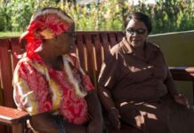 Curbside counselling? These ‘friendship benches’ bring mental health closer to home Grandmothers working with the Friendship Bench project chat before counselling sessions begin.