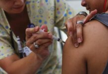 How this country is beating anti-vaxxers at their own game A teenager receives a vaccination