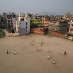 West African footballers practise at a ground in Naya Bazaar