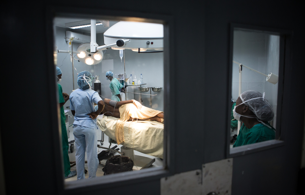 A mother delivers via C-section in Mozambique. In South Africa