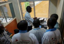 The mentally ill are not alone in Kenya Healing business: Mental health patients help out in the photocopy and printing shop in Machakos