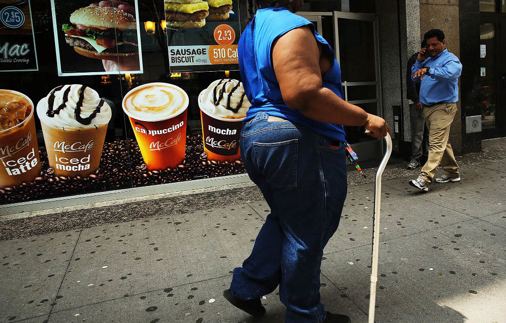 If the percentage of overweight people continues to rise at its current rate
