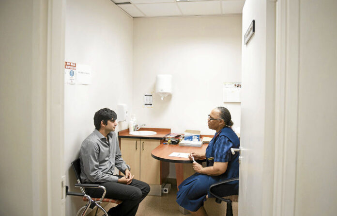 Impressed: Researcher Ché Makanjee is counselled before his HIV test at Charlotte Maxeke hospital.
