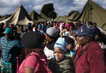 ‘If climate change goes on as is, people will need to be relocated – we need a plan’ People queue in makeshift camps following past threats of xenophobic attacks in South Africa. Today