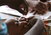 This costs just cents and could prevent half-a-million children from going blind Four-month-old Samson Salo receives a dose of vitamin A at the Madamani Dispensary during Malezi Bora.