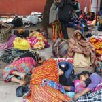 Families await medical treatment outside the All India Institute of Medical Sciences. Ayushman Bharat