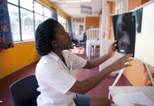 Tackling TB: Three lessons the COVID-19 pandemic taught us Medical student Inati Mcapazeli studies a chest x-ray at Cape Town’s Brooklyn Chest Hospital on World TB Day 2012.