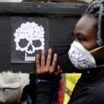 A campaigner in Nairobi carries a coffin during a protest against the construction of a coal plant in Lamu on Kenya’s coast. (Baz Ratner, Reuters)