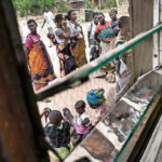 Women queue outside of a Malawian health facility for healthcare for their children. Moving rape crisis centres out of central hospitals in Malawi and into clinics closer to communities might increase the number of people who use them